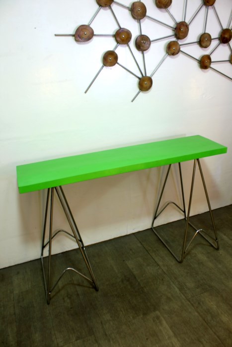 wood top is green on stainless steel stand, trestle design
