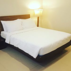 Hotel bed with headboard