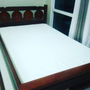 Hardwood double bed with foam