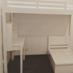White bunk bed with expandable bed and study table and shelving
